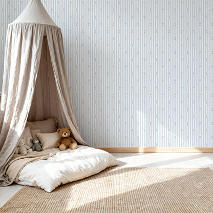 Ralphy Stripe Pale Blue wallpaper shown in a room setting